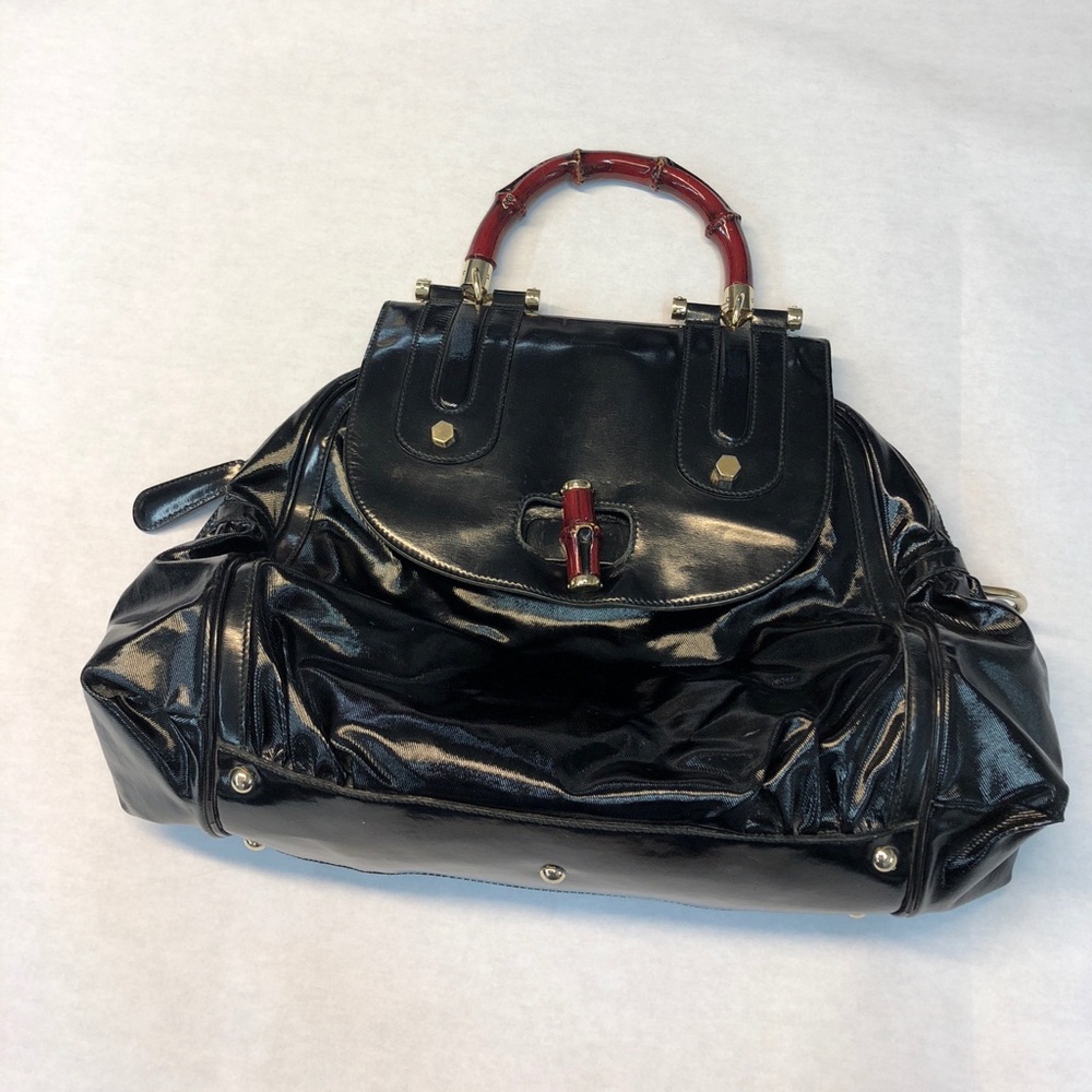 Gucci black pattern leather red bamboo handle